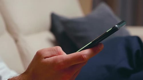 Close Up of Businessman Browsing on Smartphone