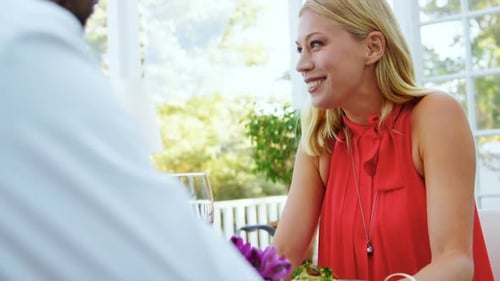 Couple interacting with each other in restaurant