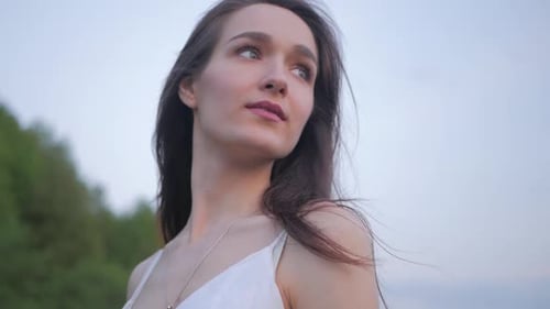 tender sensual spring fashion portrait of a beautiful happy young woman in white dress with long bro