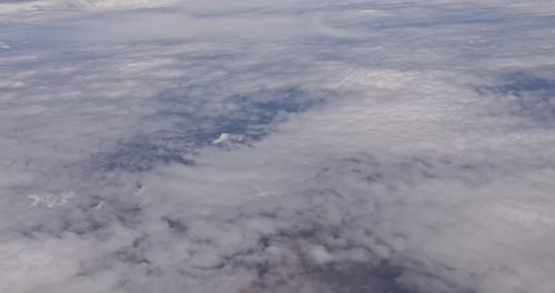 Sky View on the Plane of Airplane Flying Above the Clouds in the Sky