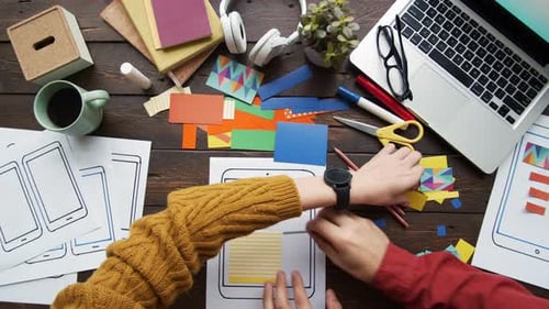 Two Mobile App Developers Working