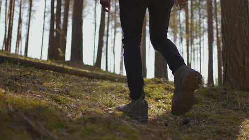 Close Up of Men Legs Hiking Steep Terrain in Slow Motion