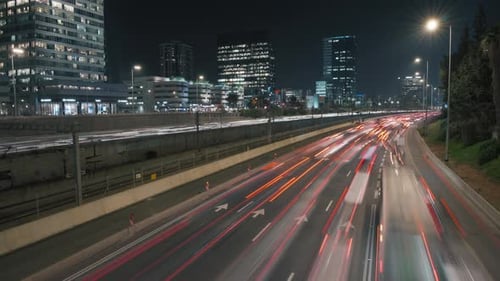 Urban Nightscape: Cars Streaking Down Highway