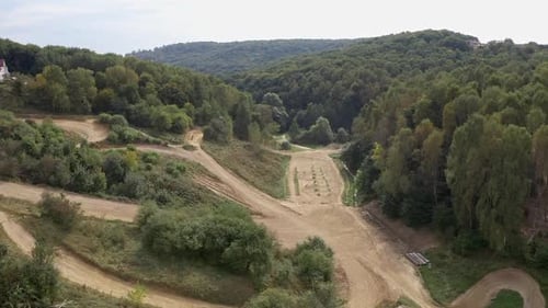 Racer On Sports Motorcycle Rides At High Speed On Dirt Road