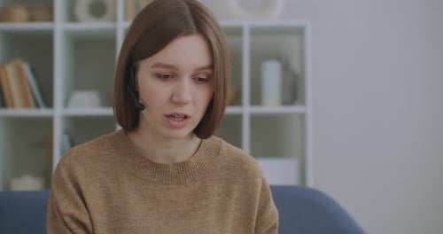Woman with Headset Talking Indoors