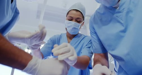 Surgeons Performing an Operation in Hospital Operating Room