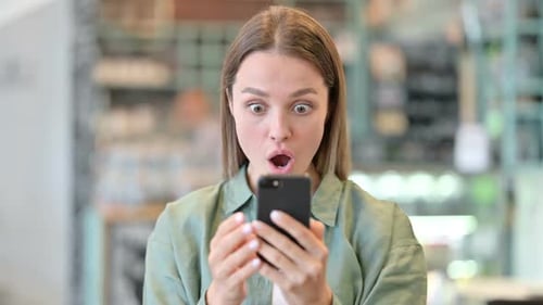 Woman Reacts in Shock to Phone News