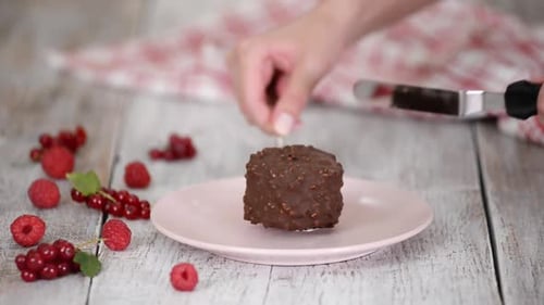 Preparing a Delicious Chocolate Dessert with Fresh Berries