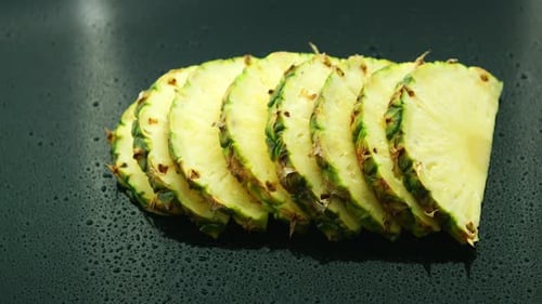 Slices of Fresh Pineapples in Row