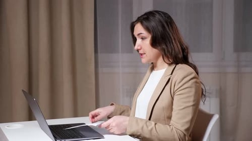 Businesswoman Leads Meeting via Video Conference Call