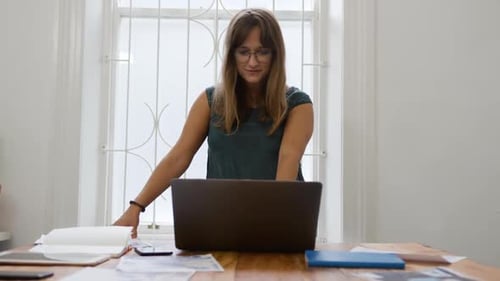 Millennial female professional working in a creative office
