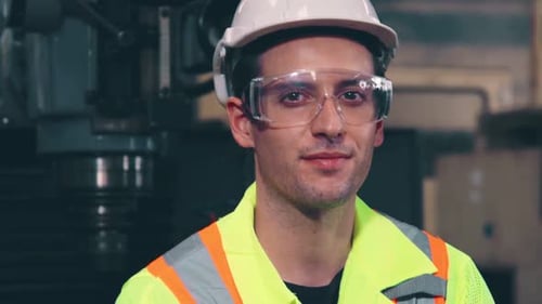 Young Factory Worker or Engineer Close Up Portrait in Factory