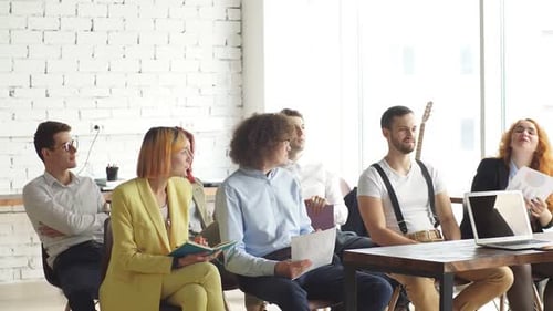 Young Adults in an Office Conference Room Meeting