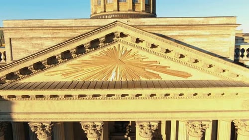 ancient building with huge columns and golden roof elements