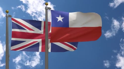 Waving Flags of United Kingdom and Chile Against Blue Sky