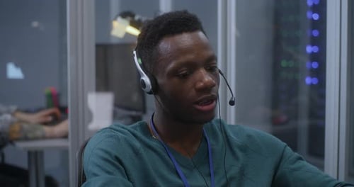 Young Man Working in Data Center