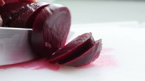 Beet root vegetable cutting on smaller pieces with knife 4K 3840X2160 UltraHD footage - Beta vulgari
