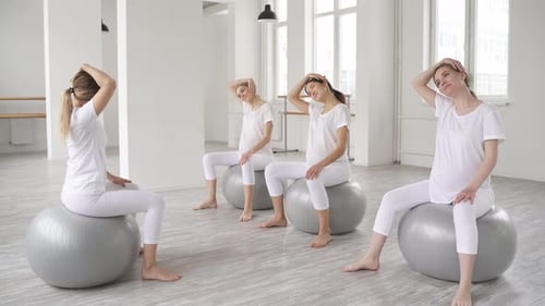 Pregnant Women Doing Yoga on Exercise Balls