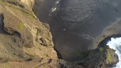 Rocky coastline, the sight of a collapsed vulcano.