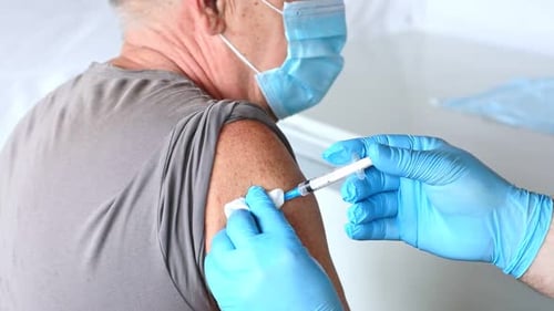 Adult Receives an Arm Vaccination in Hospital