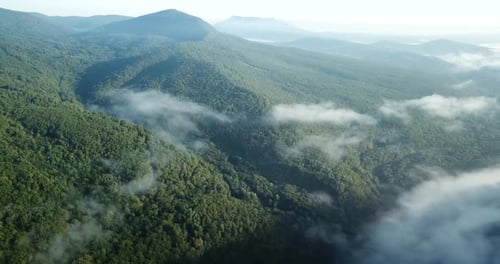 Aerial View of Green Mountains with Drifting Clouds