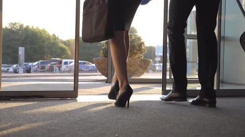 Business People Leave Airport and Walking with Their Luggage at City Street. Unrecognizable Man and