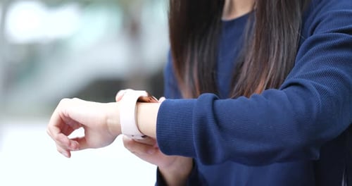 Woman Using Smart Watch Technology Outdoors