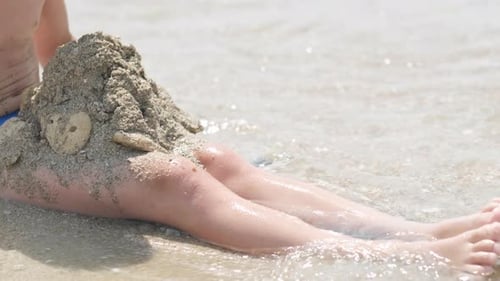Little Blonde Boy Playing with Sand on Beach Ocean Sea