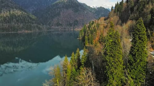 Clear Blue Mountain Lake with Reflection of Clouds on the Water