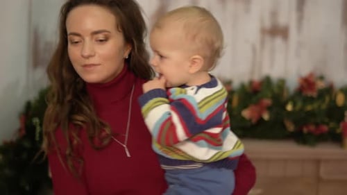 Mother and Baby Celebrate Christmas at Home