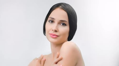 Sexy Young Brunette Girl Posing Stroking Naked Shoulder Flirting Relaxing at White Studio Background