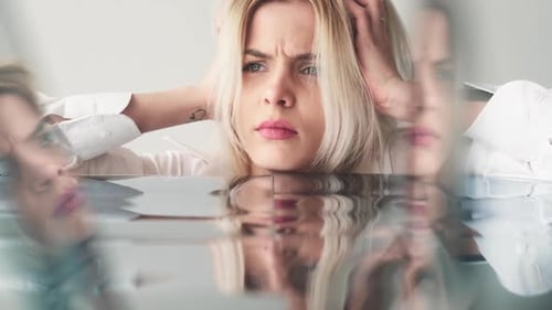 Woman with Blonde Hair, Stressed and Serious