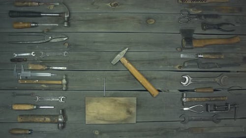 Hammering Nail into Wood with Vintage Tools
