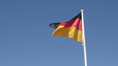 German Flag Waving in the Wind on Clear Day