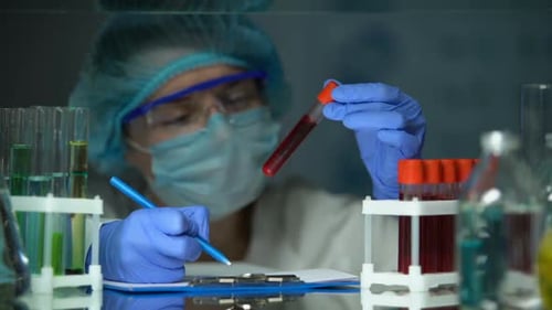 Scientist Analyzing Blood Sample in the Laboratory