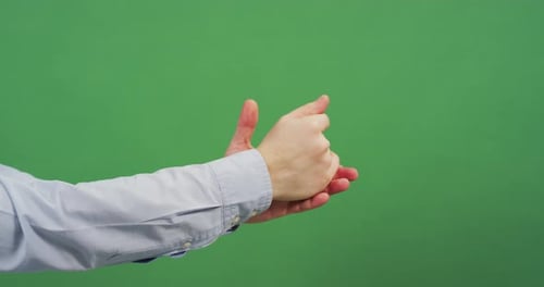 Side view of hands rubbing