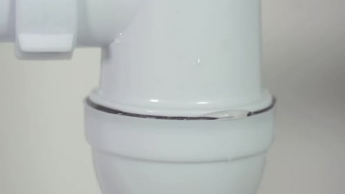 Close Up Leaking Siphon Under the Sink