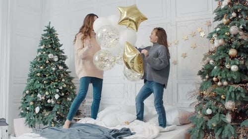 Festive Mother and Child Play with Balloons