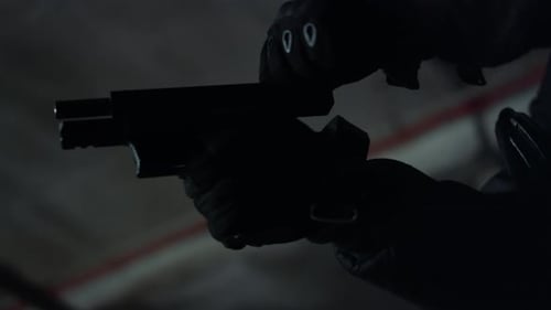 Soldier in Uniform Putting Magazine in Gun