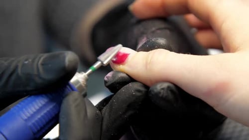 Electric Nail File Smooths the Fingernail