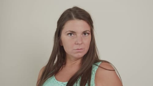 Stern Woman Looking Directly into the Camera