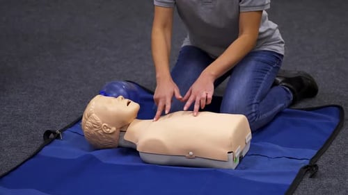Demonstration of Chest Compression on Medical Dummy