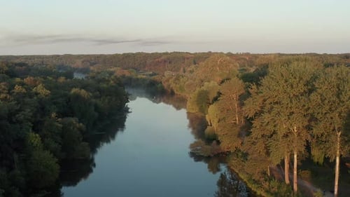 Beautiful morning, summer flight over the river. Fog, trees.