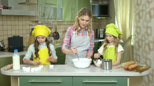 Woman and Children Cooking Pastry.