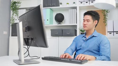 Asian handsome business man using laptop computer working in office.