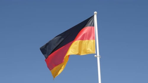 German Flag Waving against Clear Blue Sky