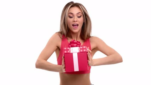 Enthusiastic Woman Presents Birthday Gift on White Background