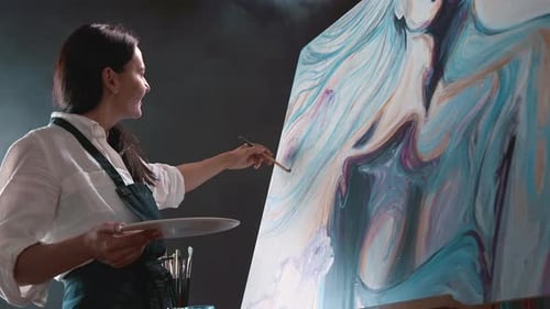 Young Female Painter Drawing Picture in Art Studio