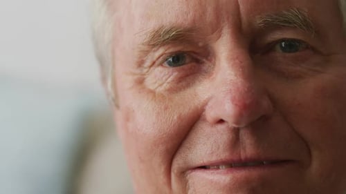 Close Up Portrait of Senior Man Blinking Calmly