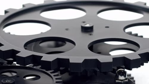 Black Gears Turning Cogs Mechanism Close Up
